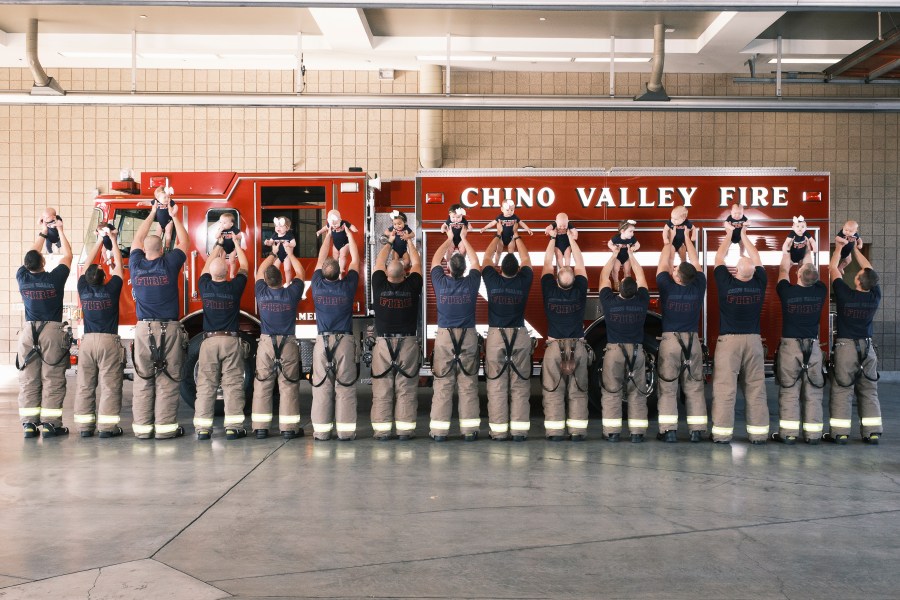 Firefighters at the Chino Valley Fire District posed with their babies in a photo shared by the agency on March 3, 2022.