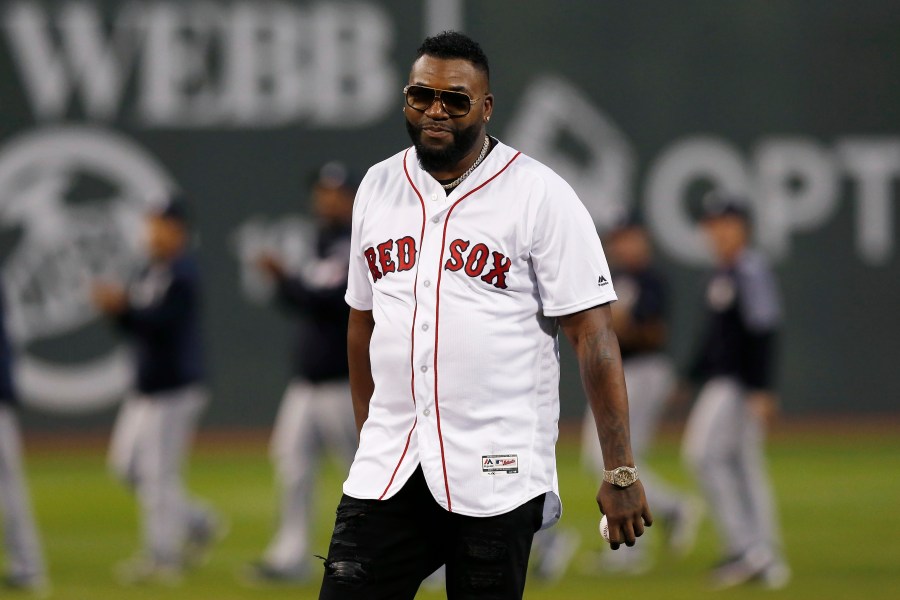 Former Boston Red Sox's David Ortiz prepares to throw out the ceremonial first pitch before a baseball game against the New York Yankees in Boston, Sept. 9, 2019. A Dominican drug trafficker orchestrated the shooting of Ortiz at a Dominican nightclub in 2019 because he felt disrespected by him and jealous, according to private investigators hired by Ortiz. (AP Photo/Michael Dwyer)