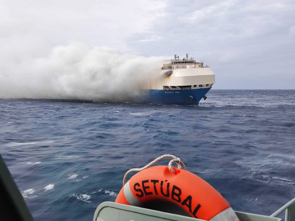 In this undated photo provided by the Portuguese Navy on Feb. 18, 2022, smoke billows from the burning Felicity Ace car transport ship as seen from the Portuguese Navy NPR Setubal ship southeast of the mid-Atlantic Portuguese Azores Islands. A large cargo vessel carrying cars from Germany to the United States has sunk in the mid-Atlantic, 13 days after a fire broke out on board. The ship’s manager and the Portuguese navy said the Felicity Ace sank Tuesday, March 1 about 400 kilometers (250 miles) off Portugal’s Azores Islands as it was being towed.(Portuguese Navy via AP, file)