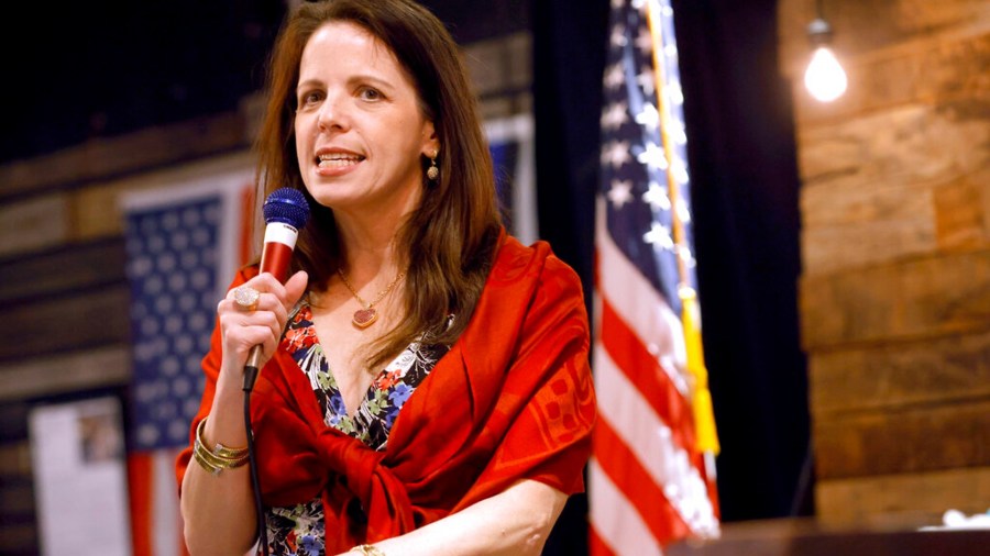 Dr. Simone Gold, founder of the anti-vaccine group America's Frontline Doctors, speaks at an event in Jenks, Okla., on June 30, 2021. Gold pleaded guilty on Thursday, March, 3, 2022, to a misdemeanor charge of entering and remaining in a restricted building or grounds for storming the U.S. Capitol during the Jan. 6 riot. As part of her plea, she acknowledged giving a speech inside the Capitol about her opposition to coronavirus vaccine mandates and lockdowns imposed by the government. (John Clanton/Tulsa World via AP, File)