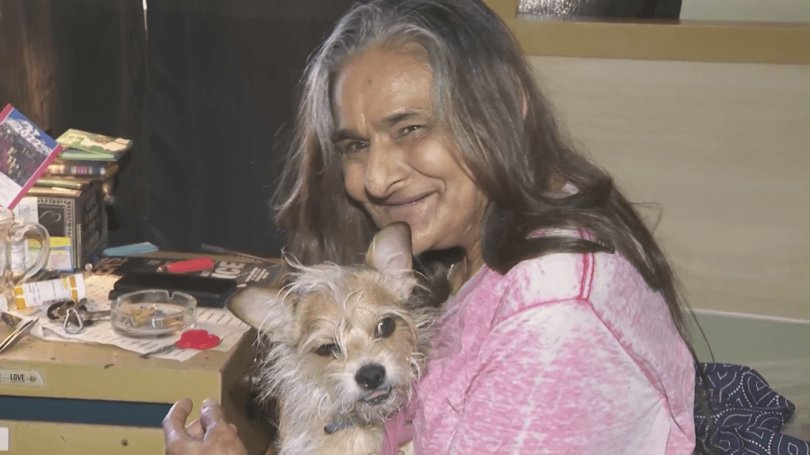 Sandra Martin and her dog, Little Man, are reunited in this March 16, 2022 image. (KTLA)