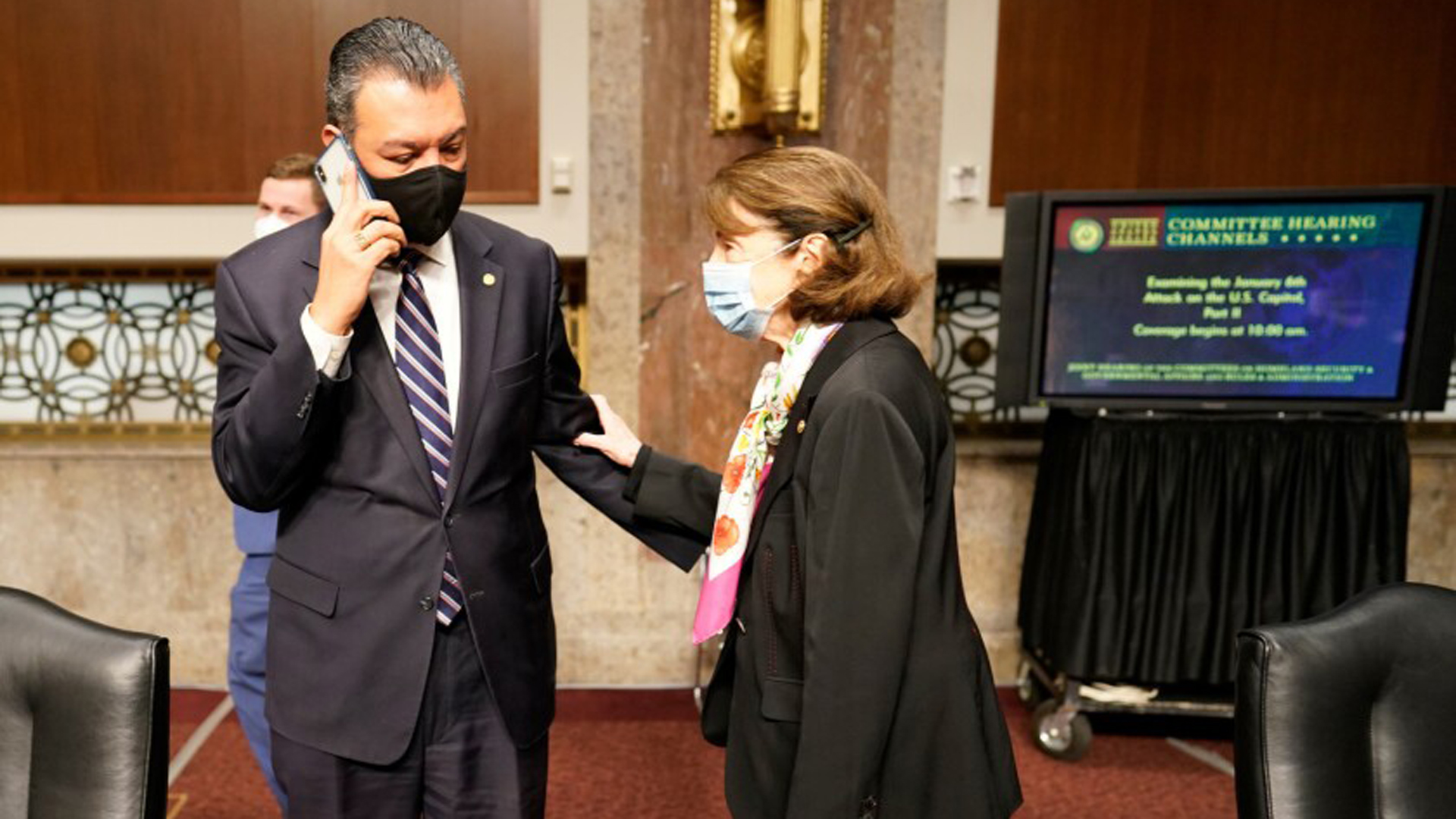 Sen. Alex Padilla (D-Calif.) talks to Sen. Dianne Feinstein (D-Calif.) on Capitol Hill in this undated photo. (Kent Nishimura/Los Angeles Times)