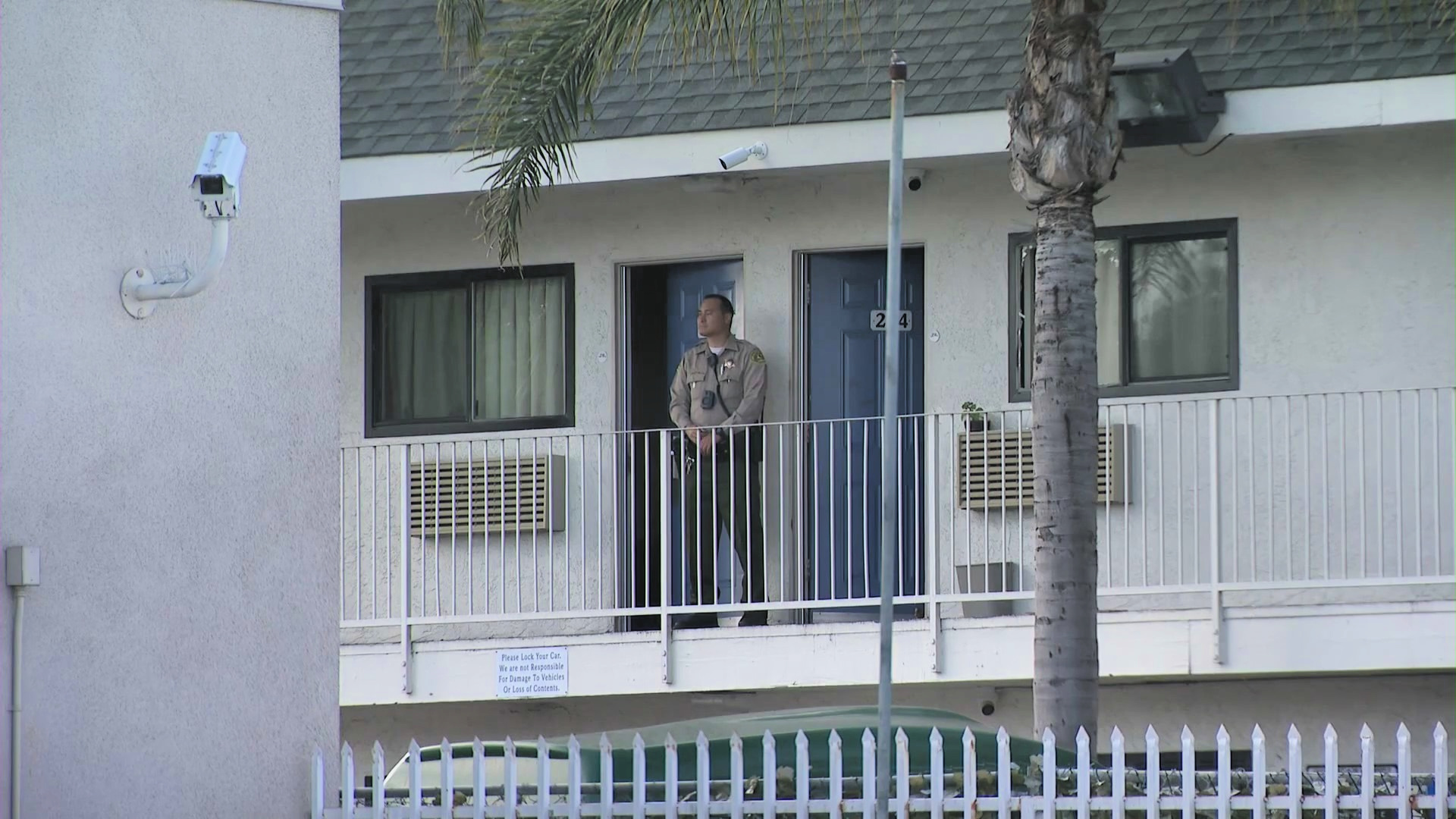 A deputy seen at a Harbor City motel following a fatal stabbing. (KTLA)