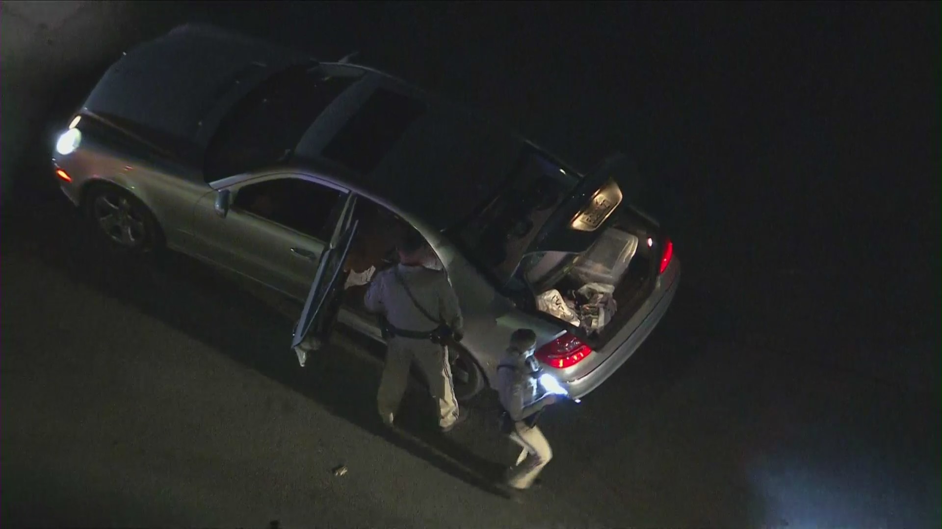 A silver Mercedes-Benz was damaged in a shooting on the 110 Freeway on April 22, 2022. (KTLA)