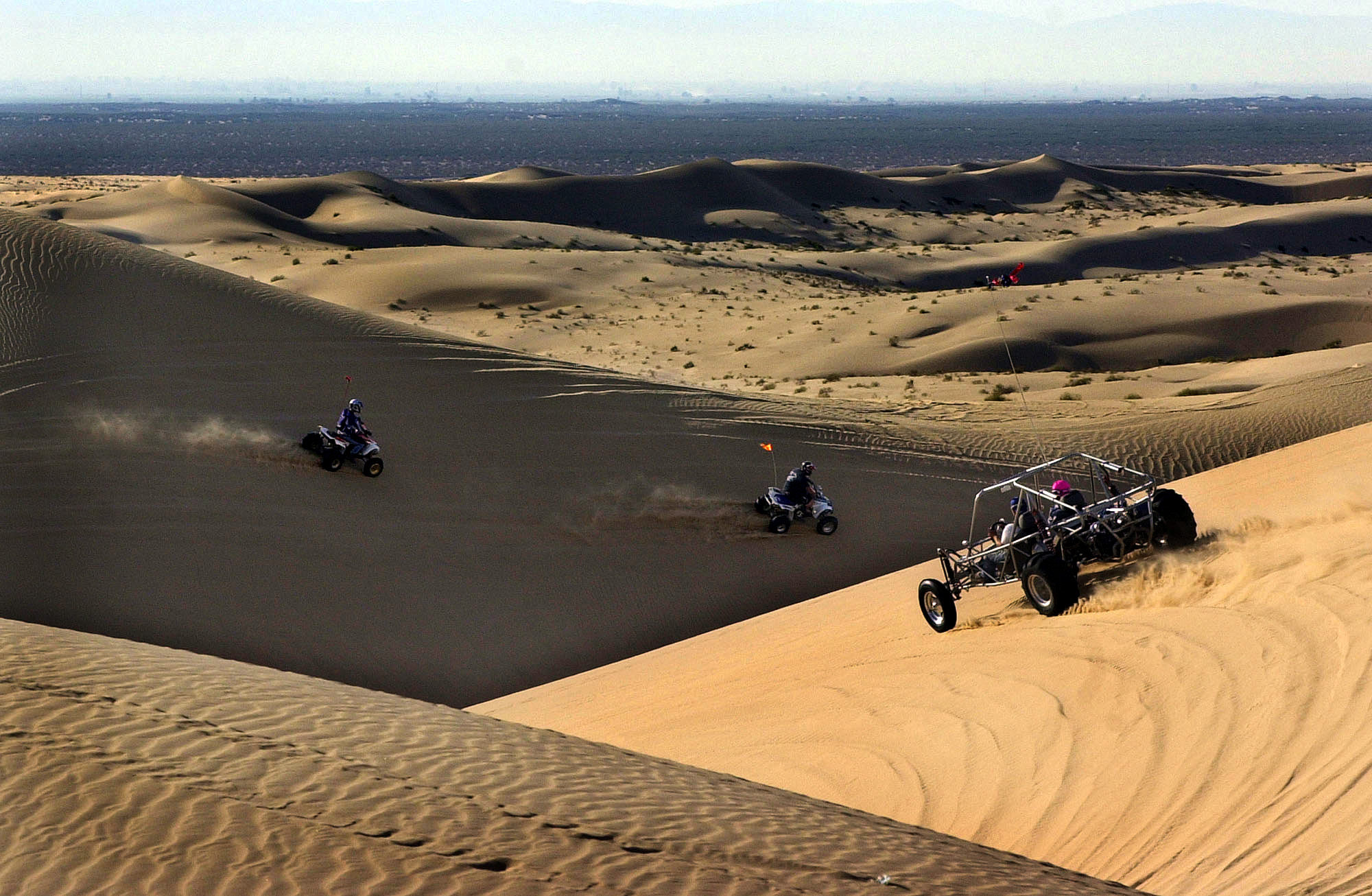 Off road enthusiasts enjoy the Imperial Sand Dunes outside of Glamis, Calif., Friday Nov. 22, 2002. (AP Photo/Tim Tadder)