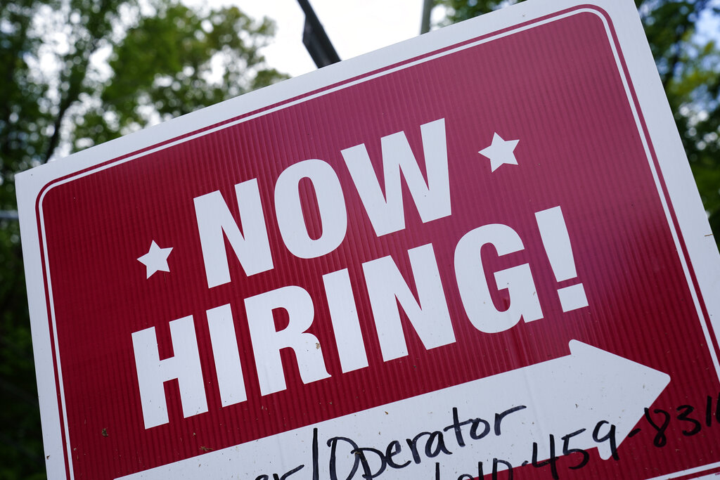 A "now hiring" sign is posted in Garnet Valley, Pa., Monday, May 10, 2021. (AP Photo/Matt Rourke, File )