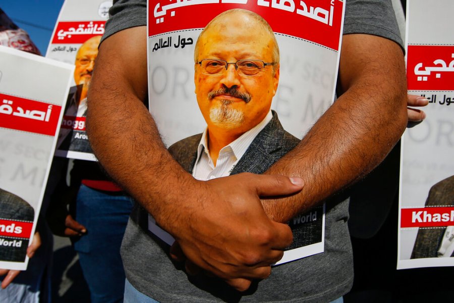 People hold posters of slain Saudi journalist Jamal Khashoggi, near the Saudi Arabia consulate in Istanbul, Oct. 2, 2020, marking the two-year anniversary of his death. (AP Photo/Emrah Gurel, File)