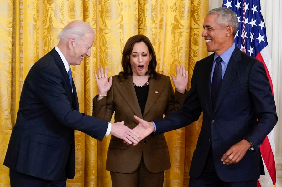 Vice President Kamala Harris reacts as President Joe Biden shakes hands with former President Barack Obama after Obama jokingly called Biden vice president in the East Room of the White House in Washington on April 5, 2022. (AP Photo/Carolyn Kaster)