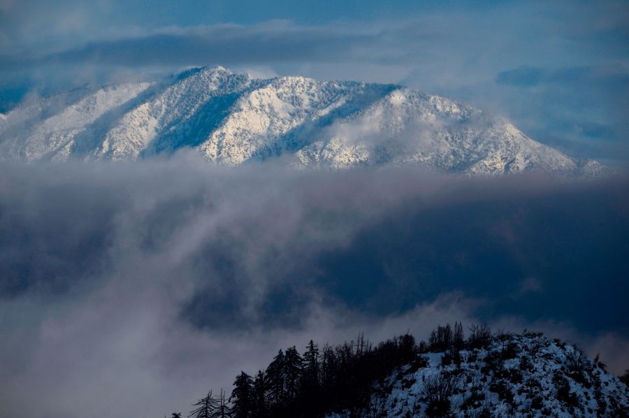 This file photo from Dec. 26, 2019 shows Mount Baldy covered in snow in the Angeles National Forest north of Los Angeles. (ROBYN BECK/AFP via Getty Images)