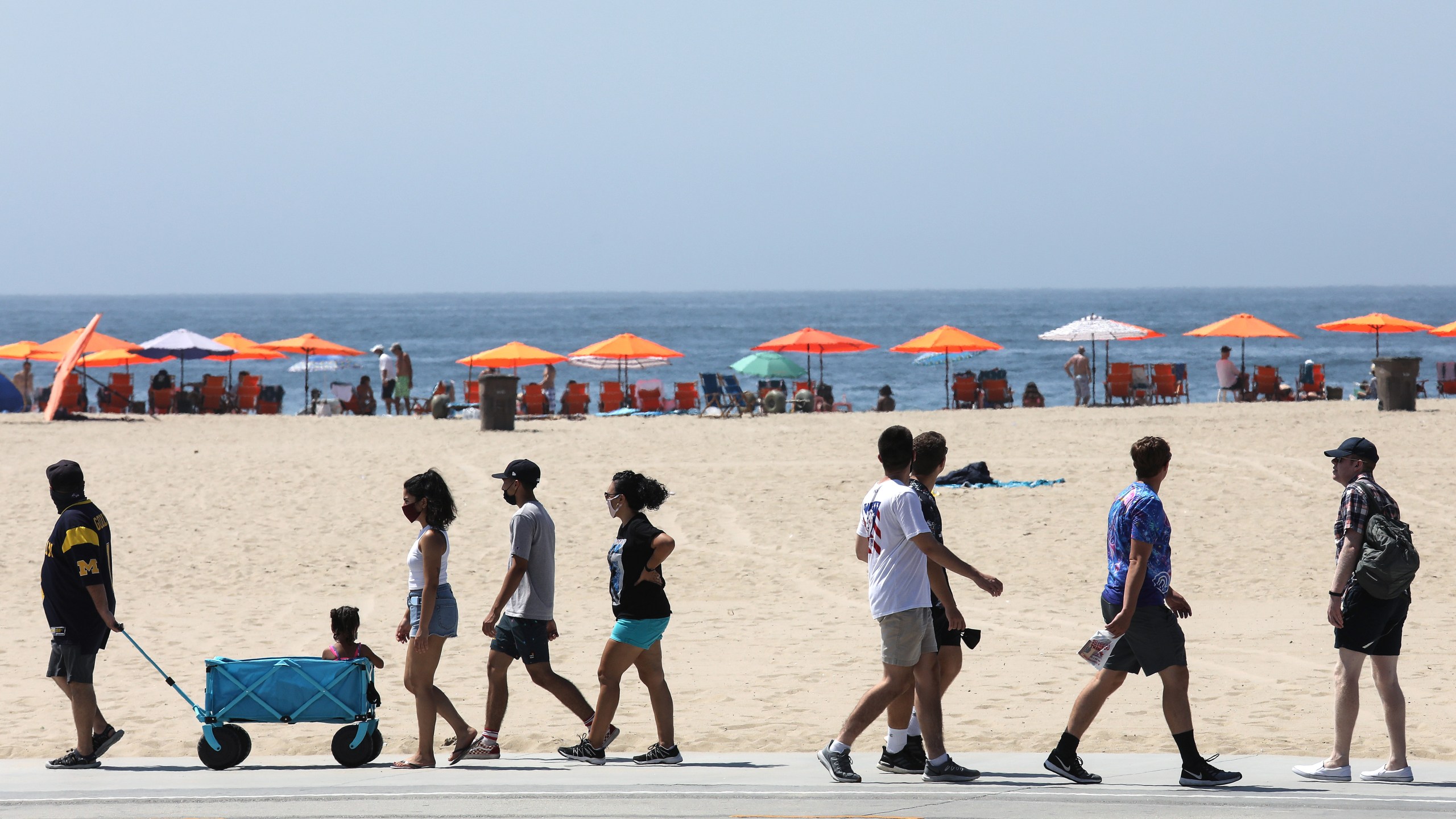 People walk along a beach bike path on Sept. 5, 2020 in Santa Monica. (Mario Tama/Getty Images)