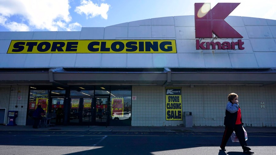 People walk into a Kmart in Avenel, N.J., Monday, April 4, 2022. When the New Jersey store closes its doors on April 16, it will leave only three remaining U.S. locations for the former retail powerhouse. (AP Photo/Seth Wenig)