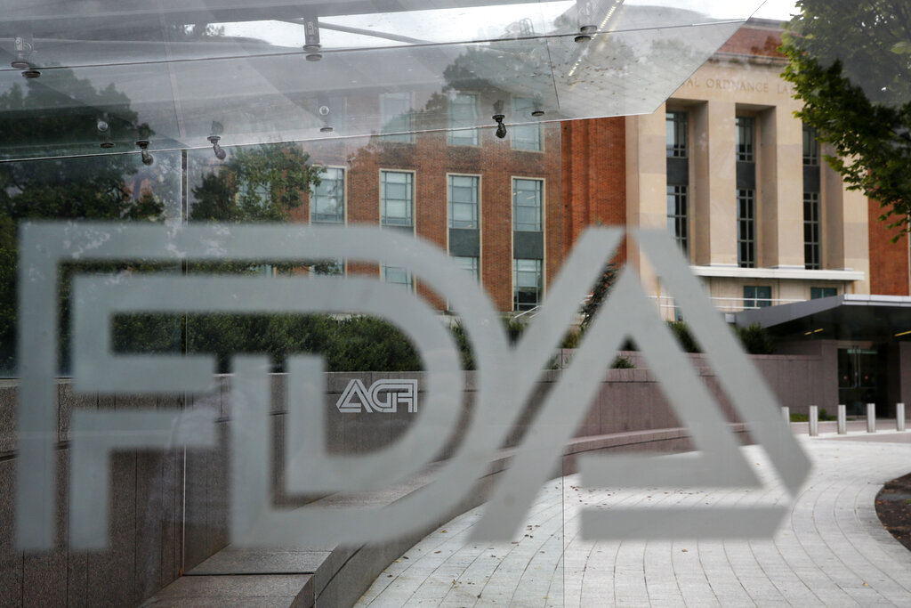 This Aug. 2, 2018, file photo shows the U.S. Food and Drug Administration building behind FDA logos at a bus stop on the agency's campus in Silver Spring, Md. (Jacquelyn Martin, File/Associated Press)