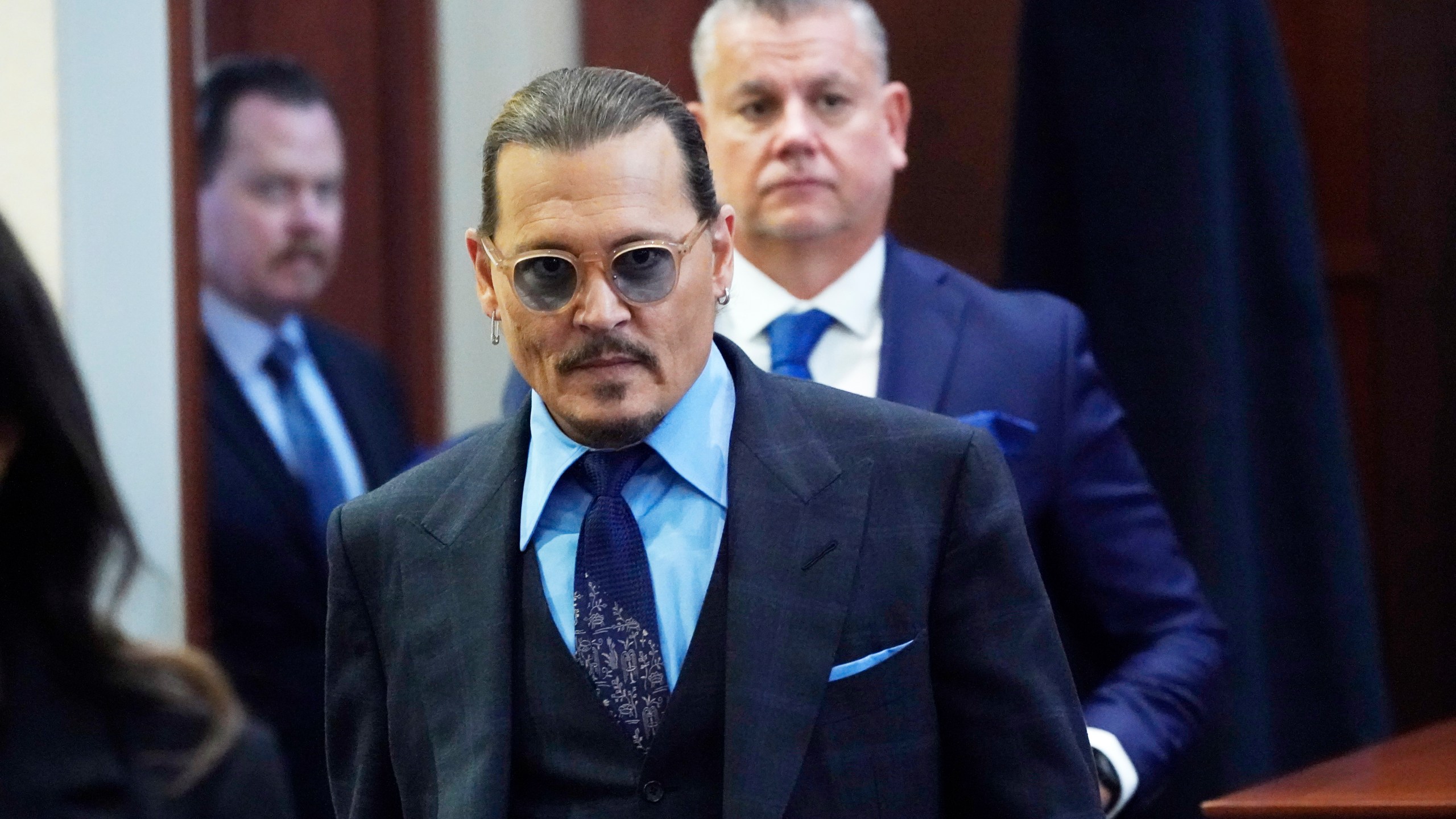 Actor Johnny Depp arrives in the courtroom after lunch, at the Fairfax County Circuit Court in Fairfax, Va., on May 2, 2022. (Steve Helber/Associated Press)