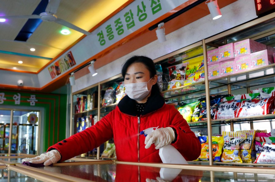 An employee of the Kyonghung Foodstuff General Store disinfects the showroom countertops in Pyongyang, North Korea, Wednesday, Nov. 10, 2021. Before acknowledging domestic COVID-19 cases, Thursday, May 12, 2022, North Korea spent 2 1/2 years rejecting outside offers of vaccines and steadfastly claiming that its superior socialist system was protecting its 26 million people from “a malicious virus” that had killed millions around the world. (AP Photo/Cha Song Ho, File)