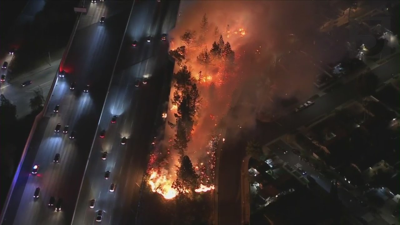 A brush fire burns in Granada Hills on May 13, 2022. (KTLA)