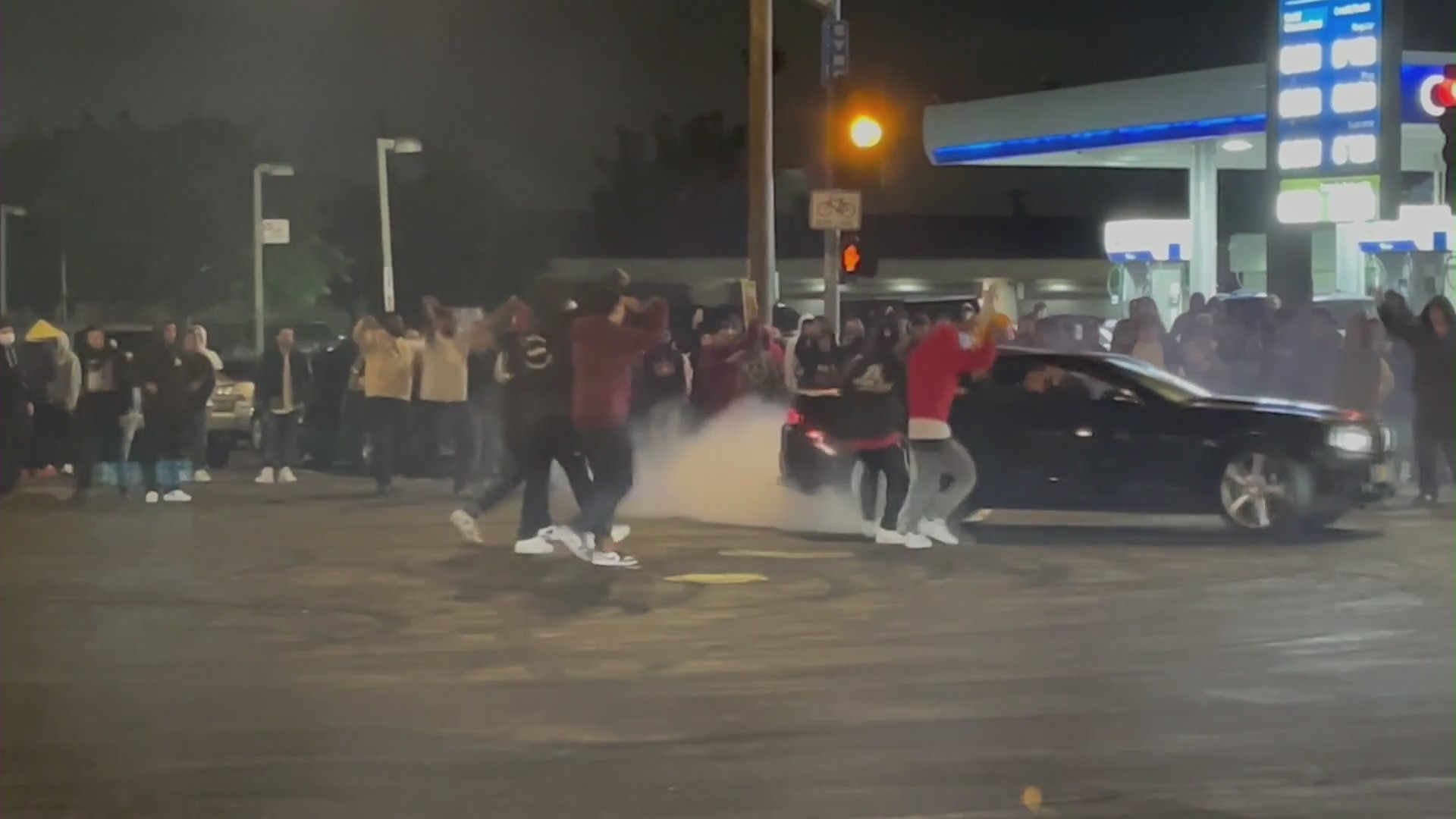 Attendees performed donuts during a street takeover in South L.A. on May 29, 2022. (RMG News)