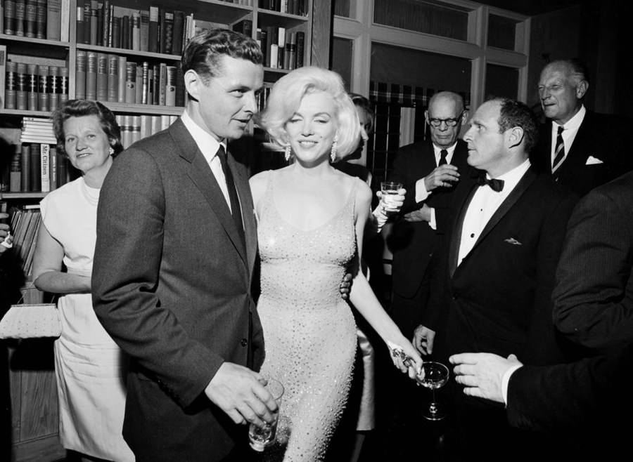 In this May 19, 1962 photo provided by the John F. Kennedy Presidential Library and Museum, actress Marilyn Monroe wears the iconic gown that she wore while singing "Happy Birthday" to President John F. Kennedy at Madison Square Garden.(Cecil Stoughton/White House Photographs, John F. Kennedy Presidential Library and Museum via AP)