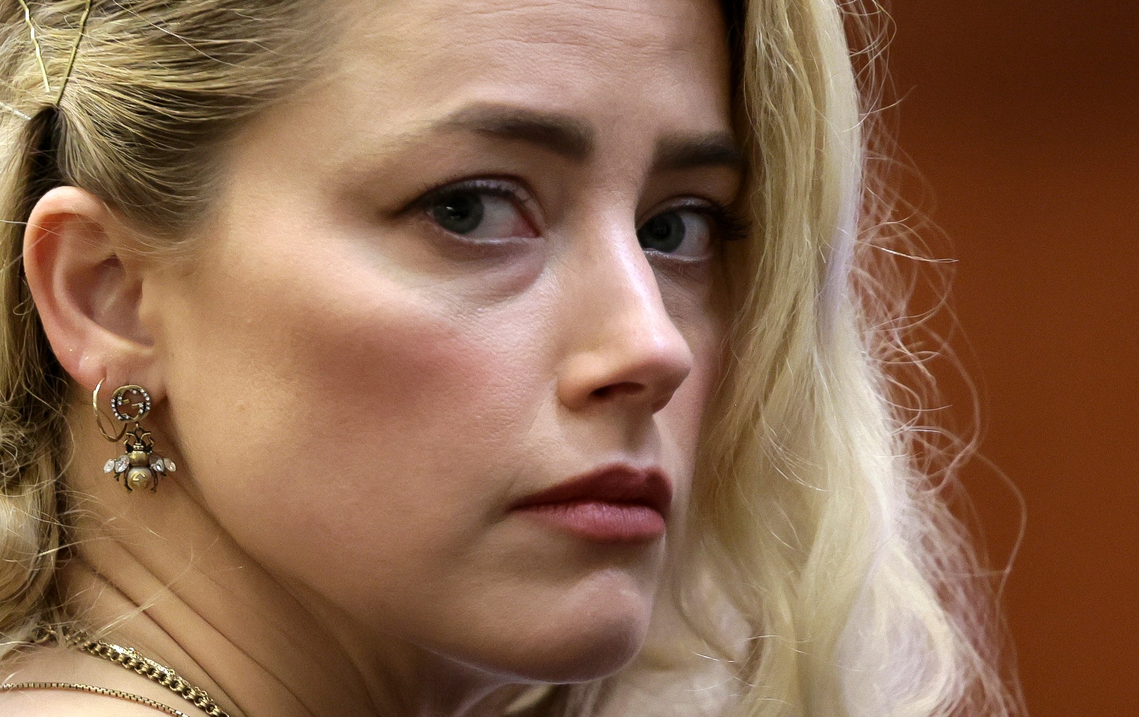 Actor Amber Heard waits before the verdict was read at the Fairfax County Circuit Courthouse in Fairfax, Va, Wednesday, June 1, 2022. The jury awarded Johnny Depp more than $10 million in his libel lawsuit against ex-wife Amber Heard. It vindicates his stance that Heard fabricated claims that she was abused by Depp before and during their brief marriage. But the jury also found in favor of Heard, who said she was defamed by a lawyer for Depp.(Evelyn Hockstein/Pool via AP)