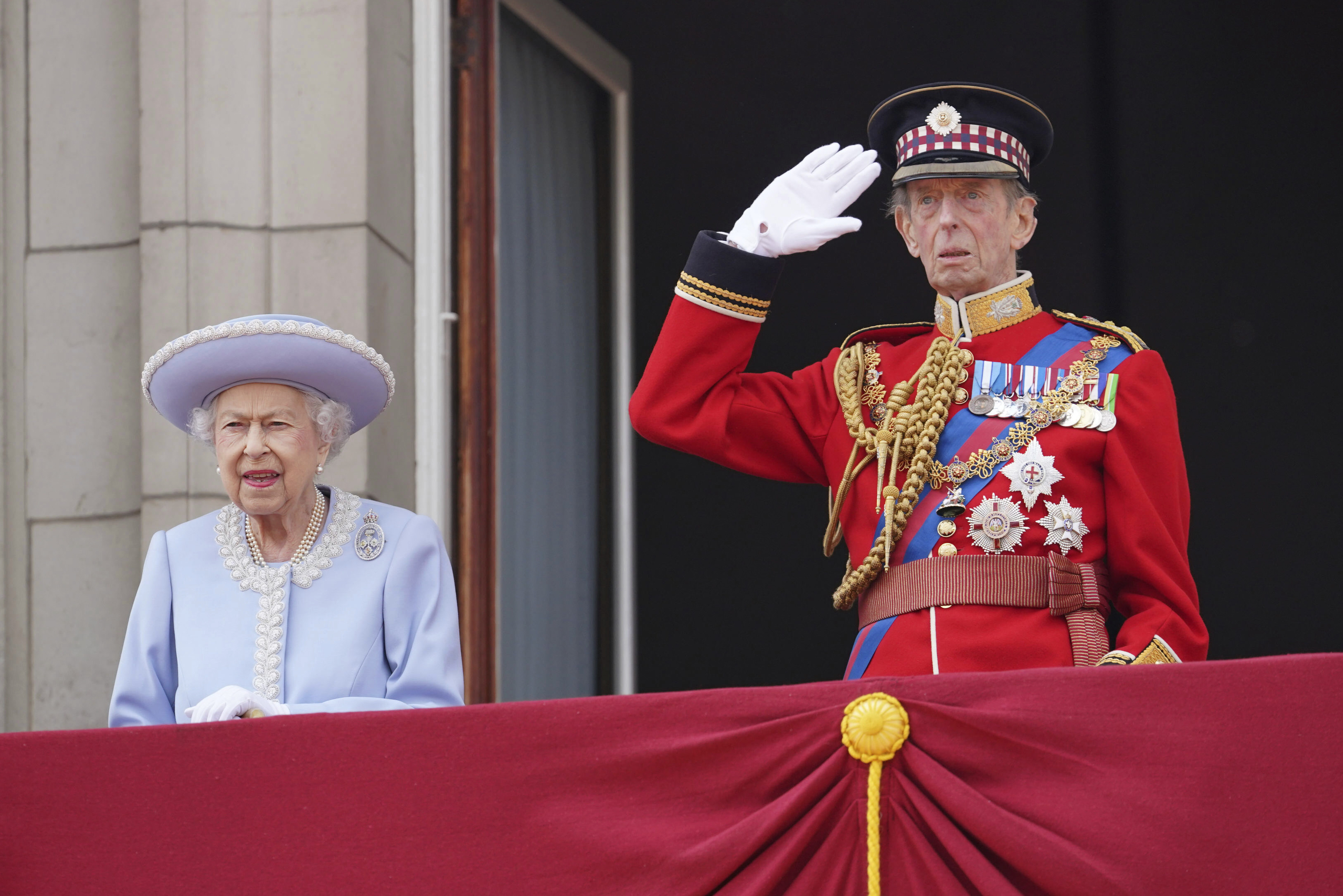 Queen Elizabeth II and the Duke of Kent watch from the balcony of Buckingham Palace after the Trooping the Color ceremony in London, Thursday, June 2, 2022, on the first of four days of celebrations to mark the Platinum Jubilee. (Jonathan Brady/Pool Photo via AP)