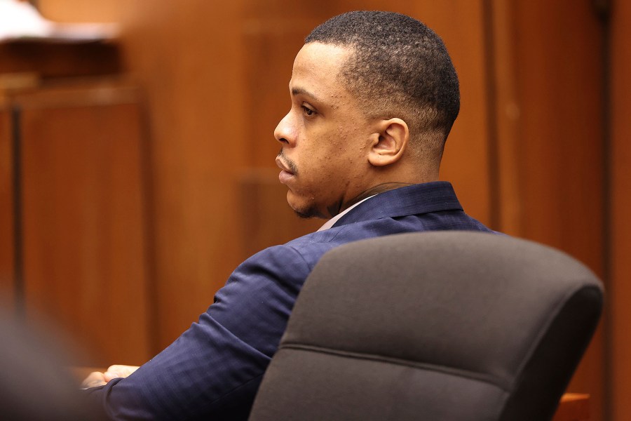 Defendant Eric Holder listens during opening statements in his murder trial on June 15, 2022, at Los Angeles Superior Court. (Frederick M. Brown/Daily Mail.com via AP, Pool)