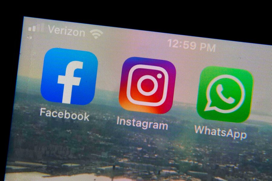 The mobile phone apps for, from left, Facebook, Instagram and WhatsApp are shown on a device in New York. (Richard Drew/Associated Press)