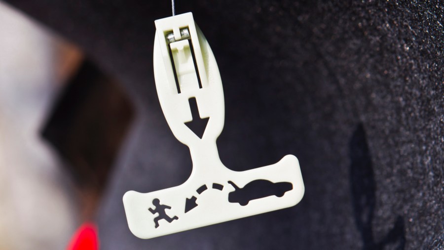 This file photo shows an emergency release lever inside a car trunk. (Getty Images)