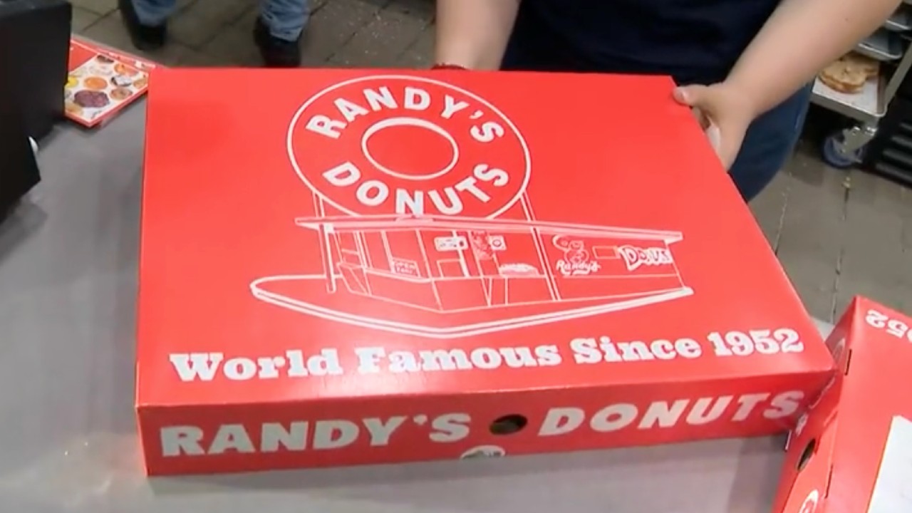 A box of tasty treats is prepared at Randy's Donuts newest location in Burbank on June 1, 2022. (KTLA)