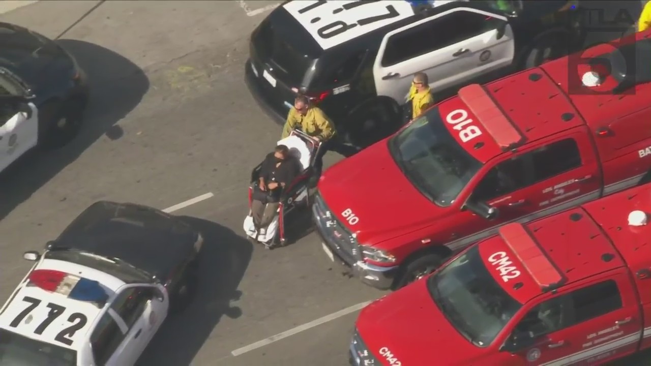 A victim is loaded into an ambulance after a reported stabbing at an Encino hospital on June 3, 2022. (KTLA)