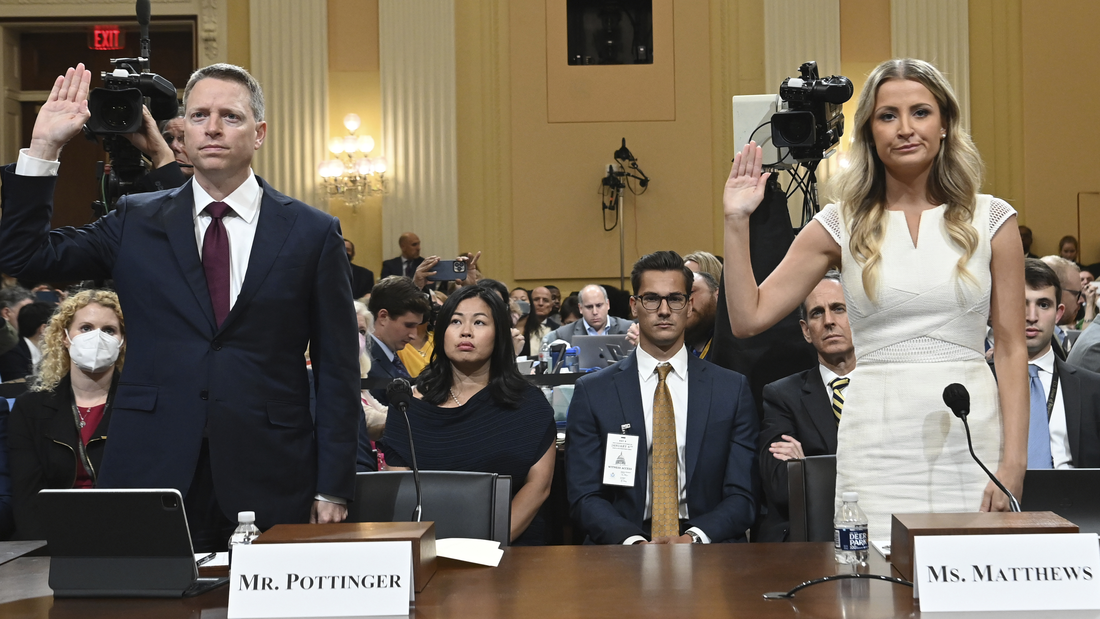 Matt Pottinger, former deputy national security adviser, and Sarah Matthews, former White House deputy press secretary, are sworn in as the House select committee investigating the Jan. 6 attack on the U.S. Capitol holds a hearing at the Capitol in Washington, Thursday, July 21, 2022. (Saul Loeb/Pool via AP)