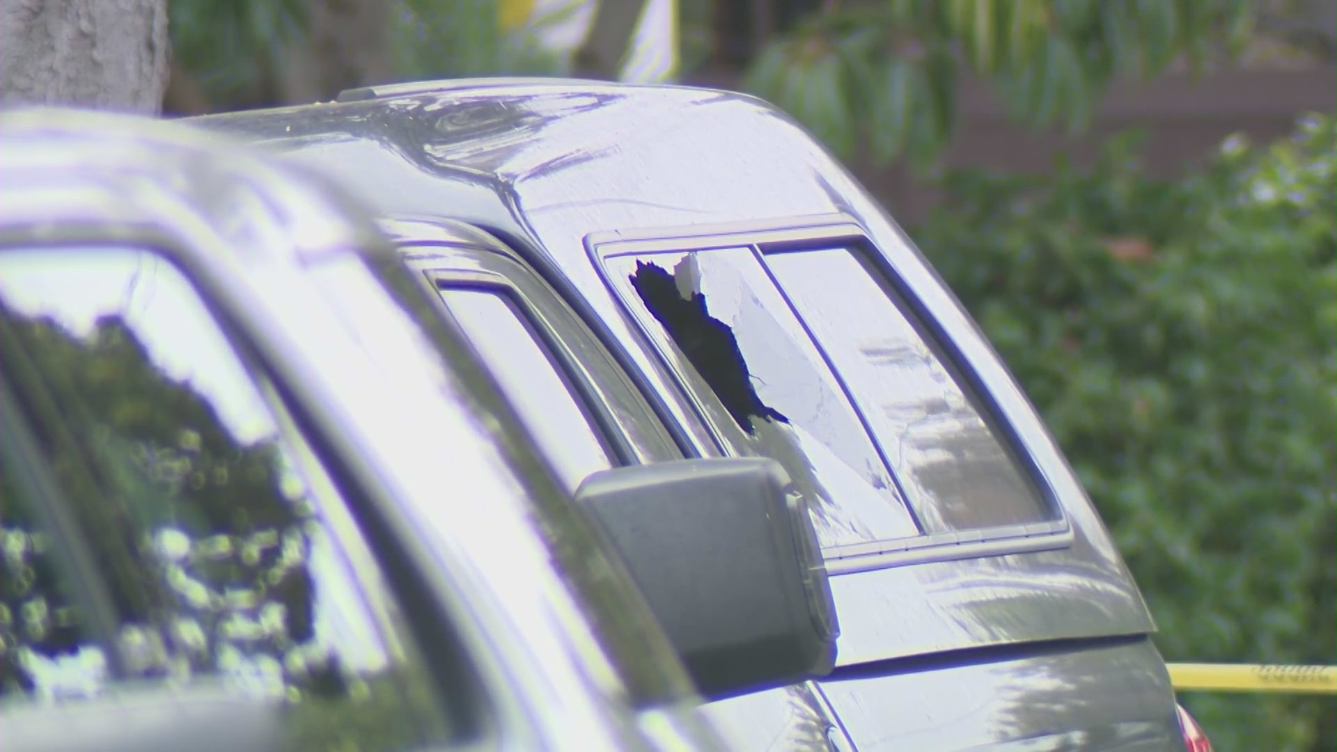 A shooting in Redondo Beach on July 23, 2022, damaged cars and neighboring homes. (KTLA)