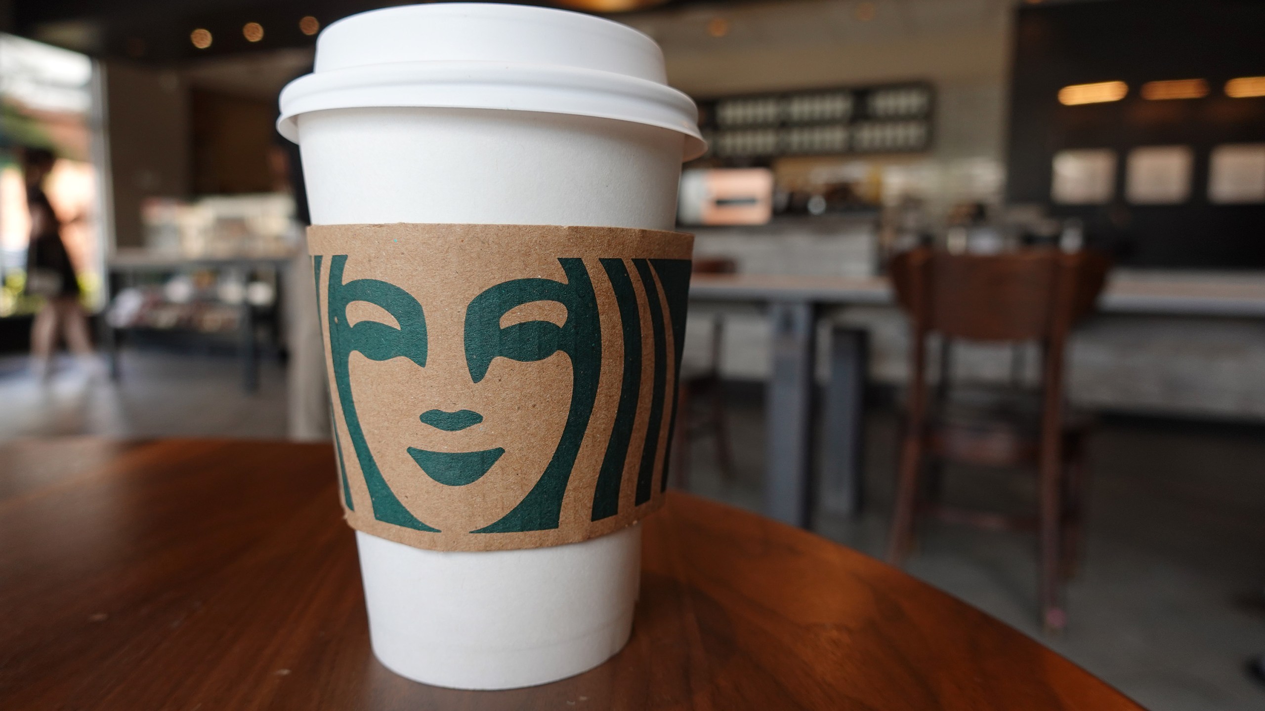 A Starbucks coffee cup sits on a table as the company reported supply shortages at some coffee shops on June 11, 2021 in Miami, Florida. (Joe Raedle/Getty Images)