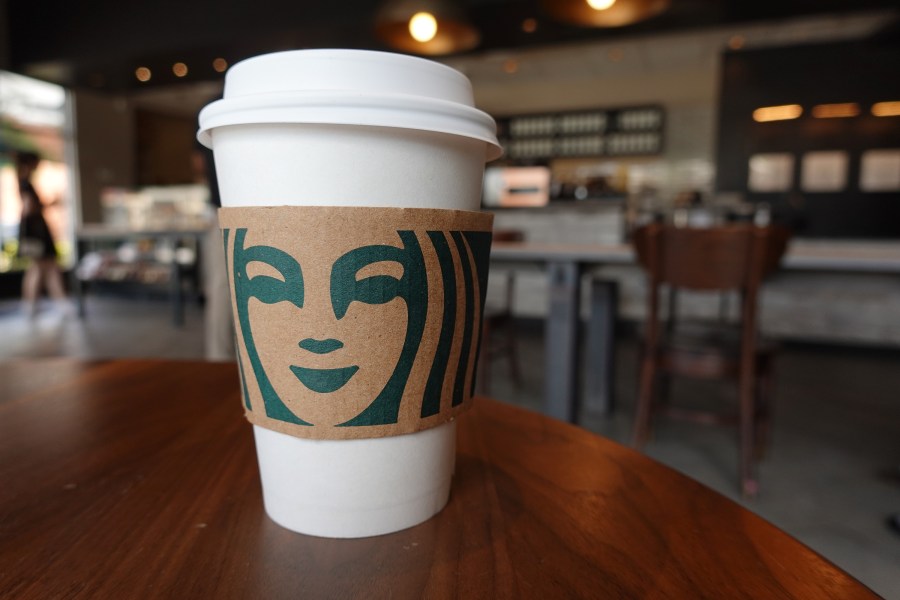 A Starbucks coffee cup sits on a table as the company reported supply shortages at some coffee shops on June 11, 2021 in Miami, Florida. (Joe Raedle/Getty Images)