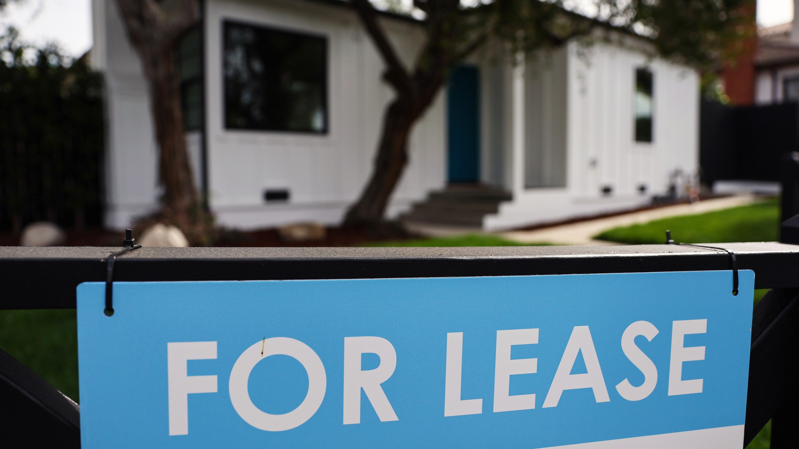 A "For Lease" sign is posted outside a house available for rent on March 15, 2022 in Los Angeles, California. Single-family rental home prices are soaring and increased a record 12.6 percent in January compared to the previous year, according to new data from CoreLogic. (Photo by Mario Tama/Getty Images)