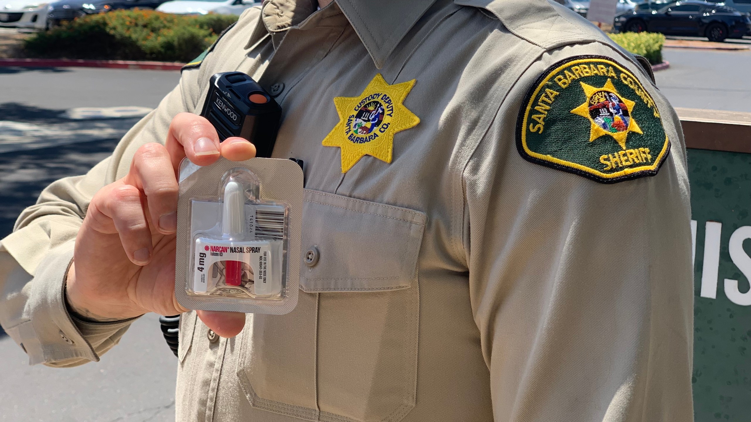 Deputy holding Narcan, a nasal spray overdose treatment, after an apparent overdose at the Santa Barbara County Jail