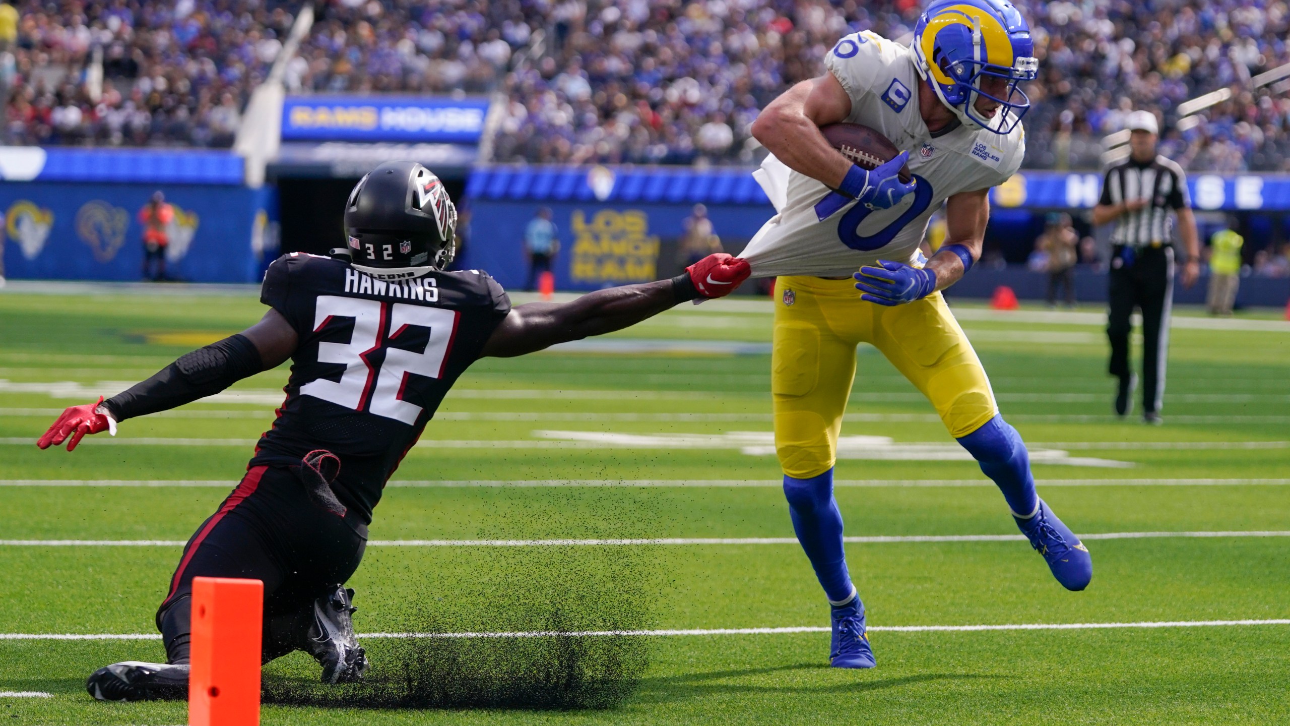 Los Angeles Rams wide receiver Cooper Kupp, right, gets away from Atlanta Falcons safety Jaylinn Hawkins as he scores a touchdown during the second half of an NFL football game Sunday, Sept. 18, 2022, in Inglewood, Calif. (AP Photo/Mark J. Terrill)