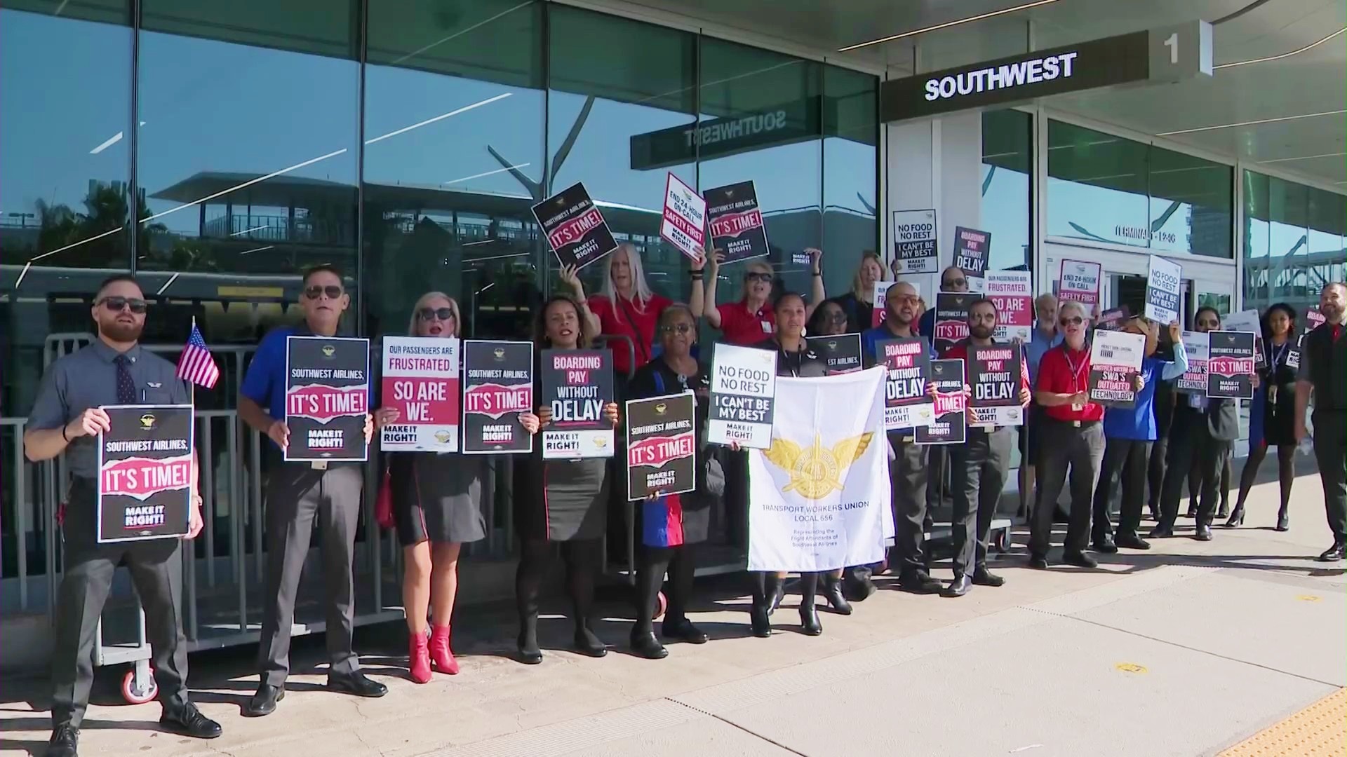 Demonstrators are seen outside LAX on Sept. 27, 2022. (KTLA)