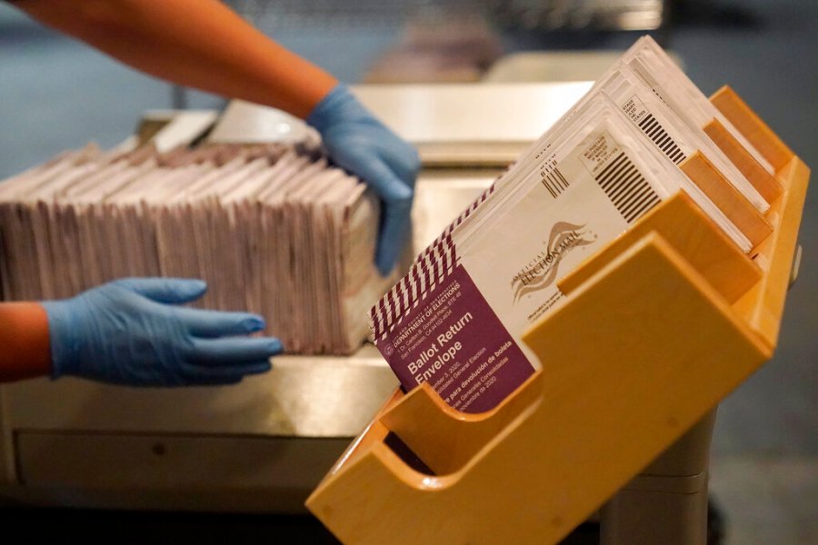 FILE - In this Nov. 1, 2020, file photo, envelopes containing ballots are shown at a San Francisco Department of Elections at a voting center in San Francisco. (AP Photo/Jeff Chiu, File)