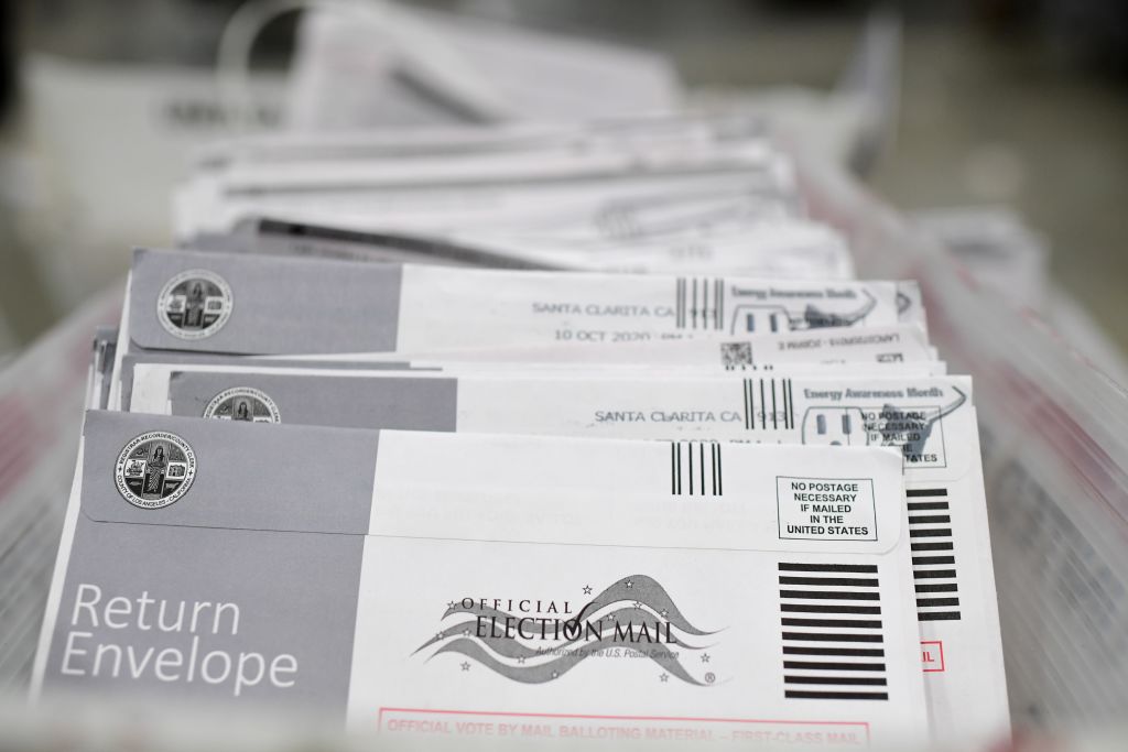 Mail-in ballots in their envelopes await processing at the Los Angeles County Registrar Recorders' mail-in ballot processing center at the Pomona Fairplex in Pomona, California, October 28, 2020. (Photo by ROBYN BECK/AFP via Getty Images)