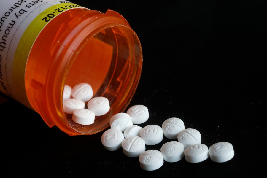 This Aug. 29, 2018, photo shows an arrangement of prescription Oxycodone pills. A Southern California doctor pleaded guilty Friday, Oct. 7, 2022, to writing prescriptions for more than 120,000 opioid pills over a six-year span, including to an impaired driver who struck and killed a bicyclist, federal prosecutors said. (AP Photo/Mark Lennihan)