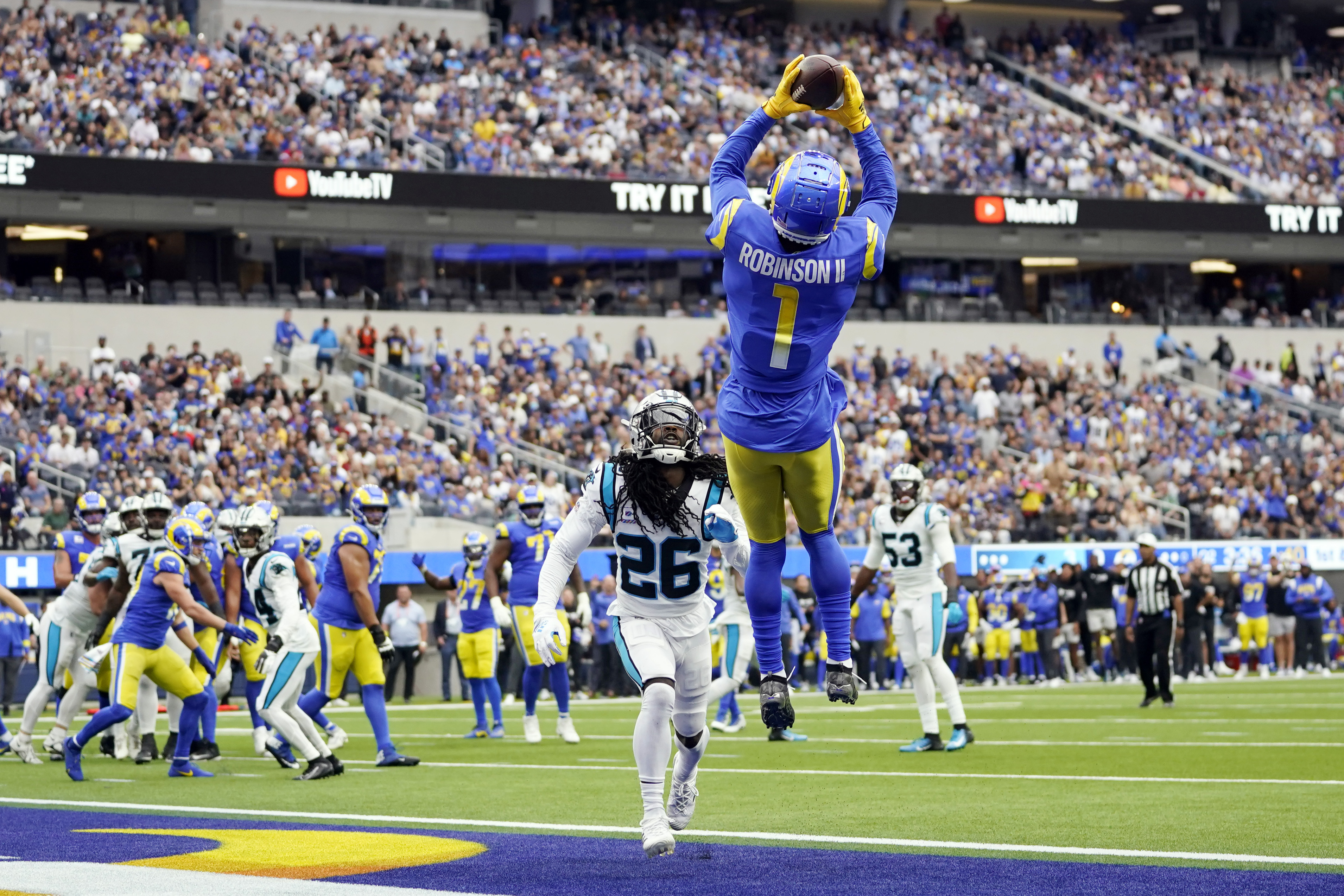 Los Angeles Rams wide receiver Allen Robinson II makes a touchdown catch over Carolina Panthers cornerback Donte Jackson during the first half of an NFL football game Sunday, Oct. 16, 2022, in Inglewood. (AP Photo/Ashley Landis)