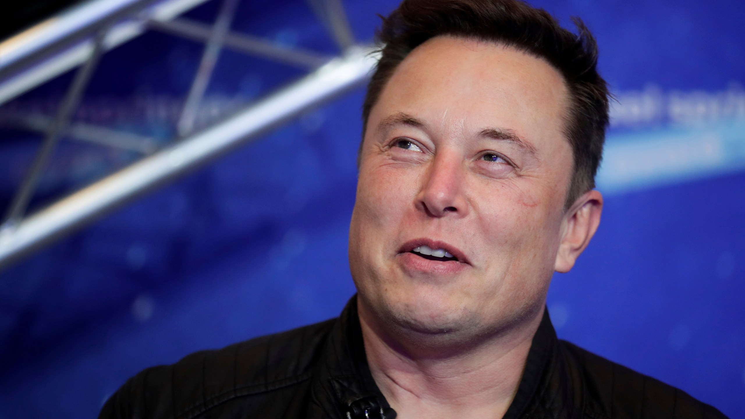 Tesla and SpaceX CEO Elon Musk arrives on the red carpet for the Axel Springer media award in Berlin on Dec. 1, 2020. (Hannibal Hanschke/Pool Photo via AP)