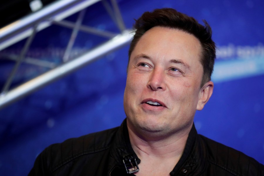 Tesla and SpaceX CEO Elon Musk arrives on the red carpet for the Axel Springer media award in Berlin on Dec. 1, 2020. (Hannibal Hanschke/Pool Photo via AP)