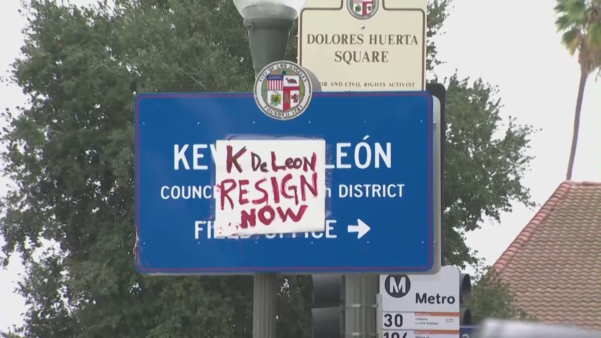 A sign denoting the city district of Councilmember Kevin de Leon is covered with a message calling for his resignation. Photo take in Boyle Heights on Oct. 15, 2022 (KTLA)