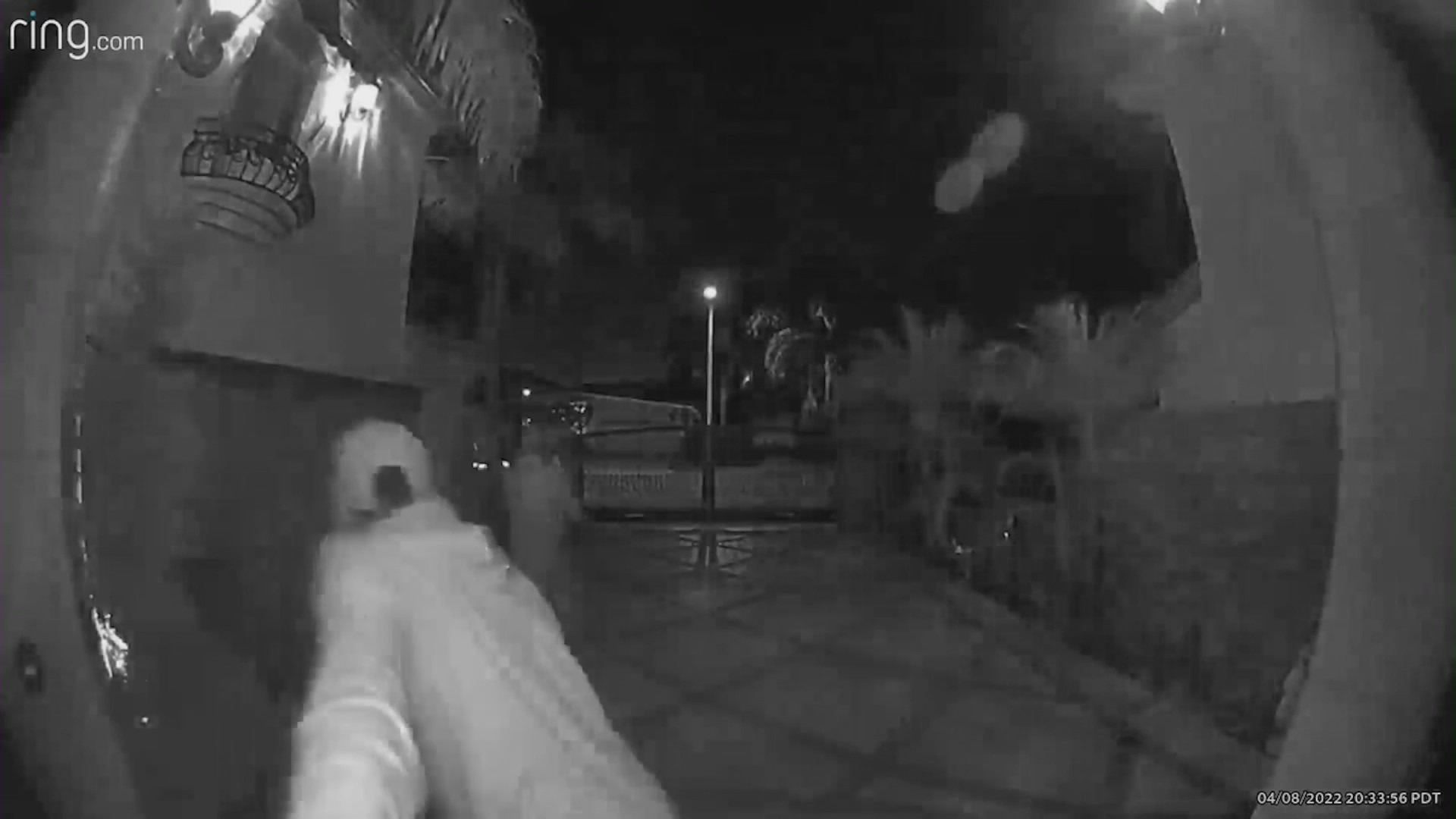 Security doorbell footage of three men breaking into Cari Castaneda's home.