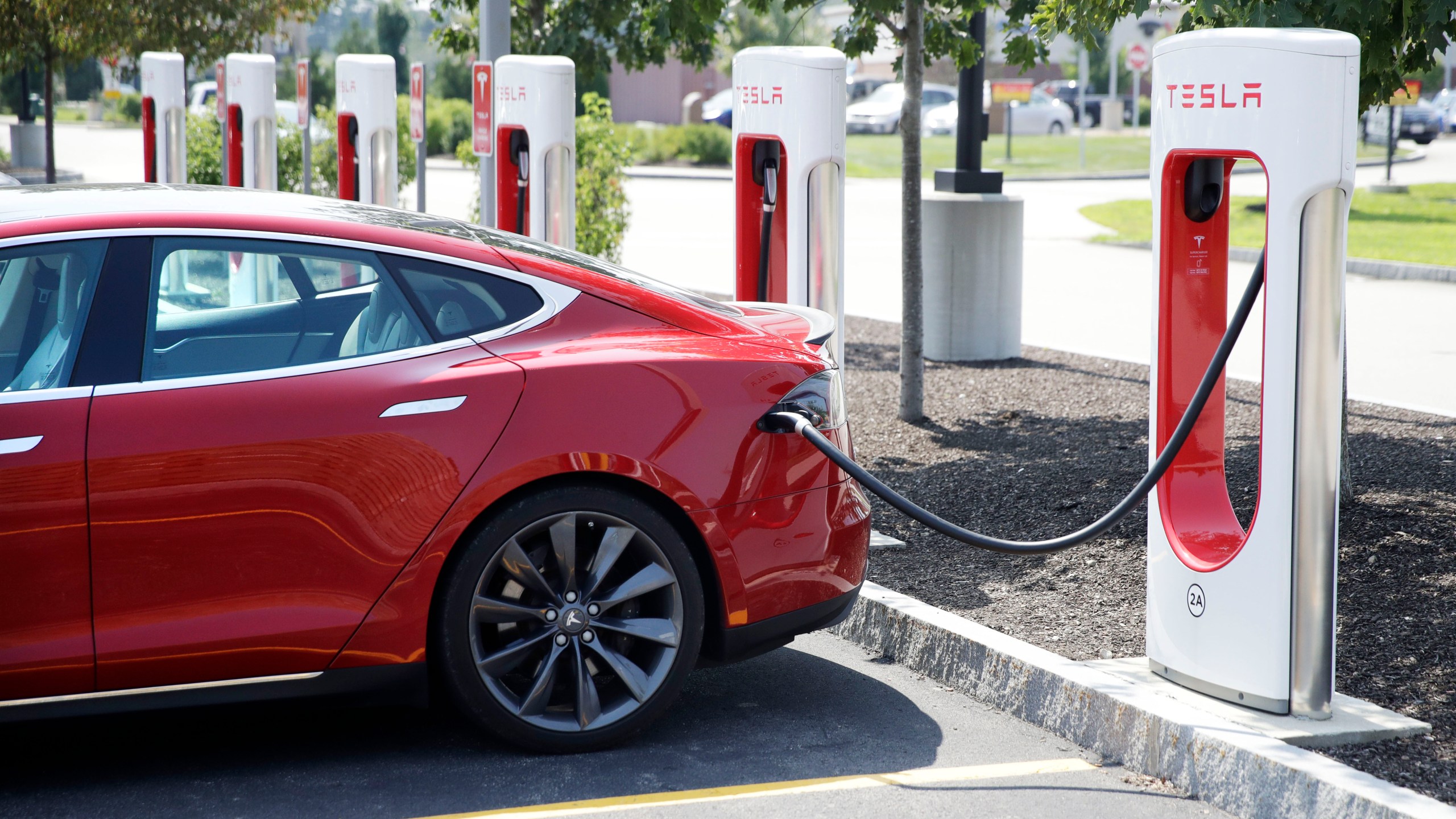 A Tesla Model S is plugged in at a vehicle Supercharging station in Seabrook, N.H., on Aug. 24, 2018. (Charles Krupa/Associated Press)