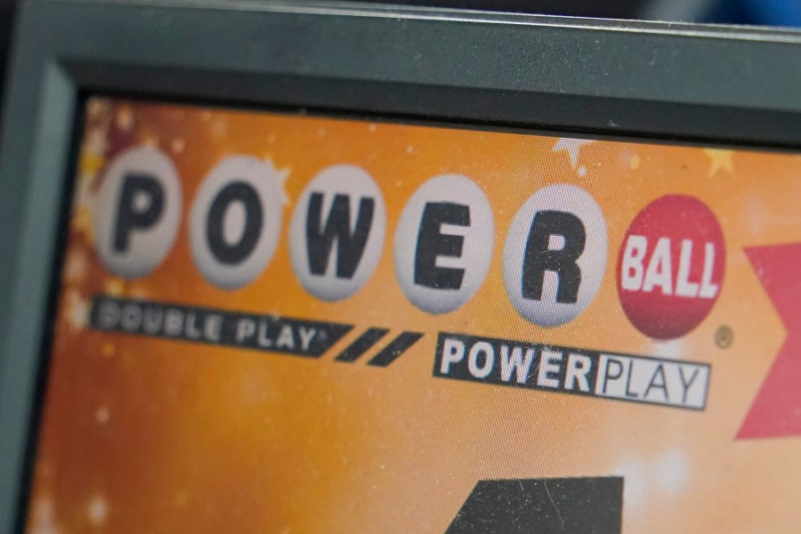 The display panel advertising the tickets for the Monday Powerball drawing with an annuity value of at least $1.9 billion, are shown at a convenience store, Monday, Nov. 7, 2022, in Renfrew, Pa. (AP Photo/Keith Srakocic)