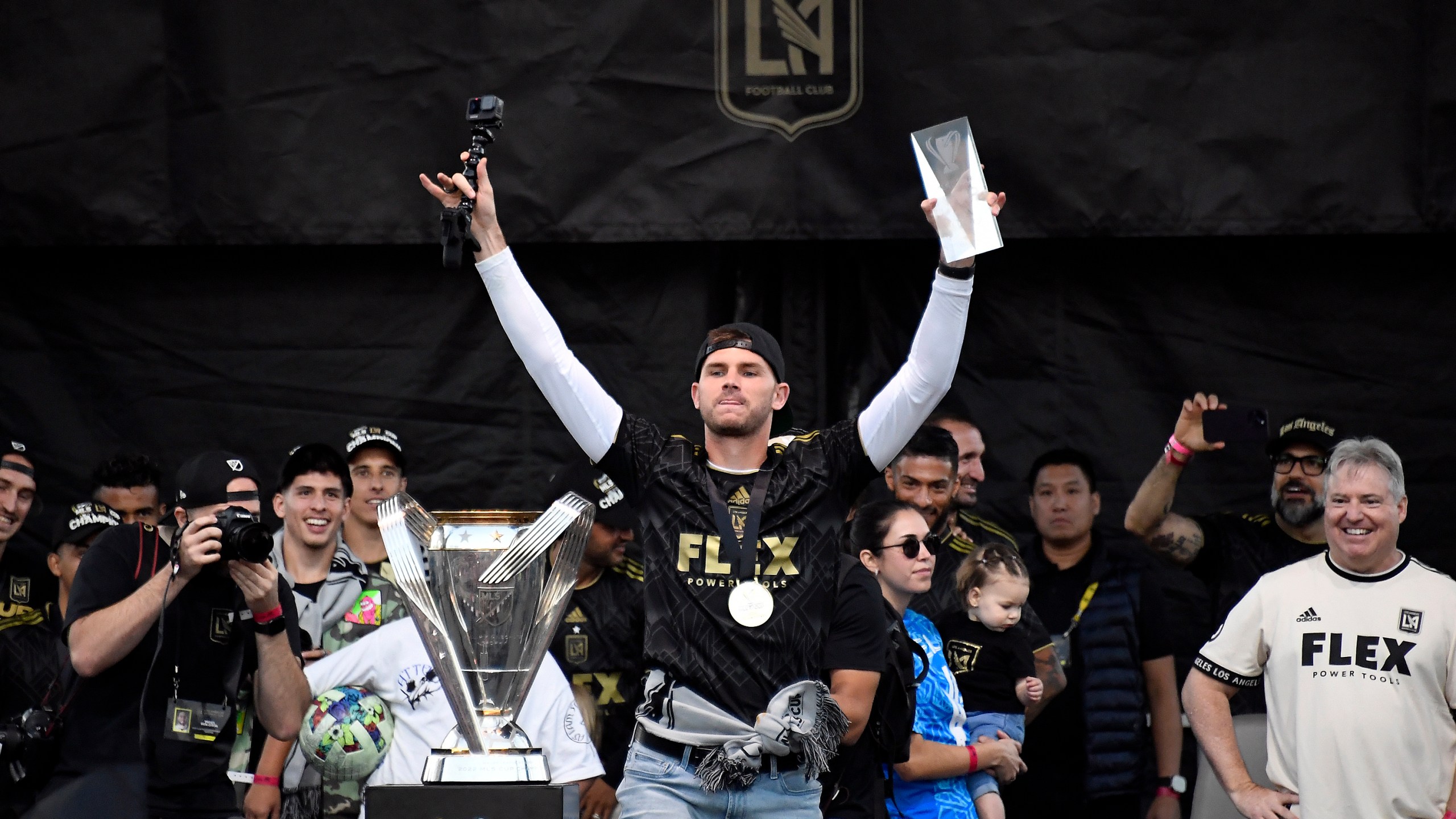 Back up goalie John McCarthy #77 of Los Angeles FC holding the, MVP of the final match, celebrates during the MLS Cup victory parade and celebration next to Banc of California Stadium on Nov. 6, 2022 in Los Angeles. (Kevork Djansezian/Getty Images)