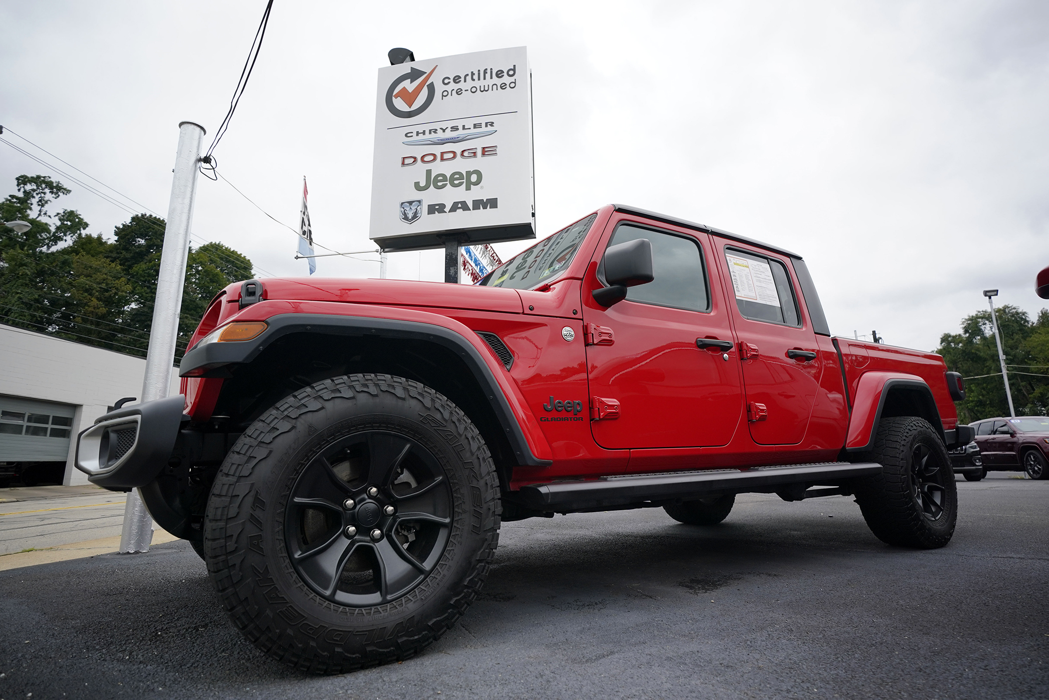 A used 2020 Jeep is on display on a lot in Pittsburgh, Thursday, Sept. 29, 2022. Price increases moderated in the United States last month, Thursday, Nov. 10, in the latest sign that the inflation pressures that have gripped the nation might be easing as the economy slows and consumers grow more cautious. (AP Photo/Gene J. Puskar, File)