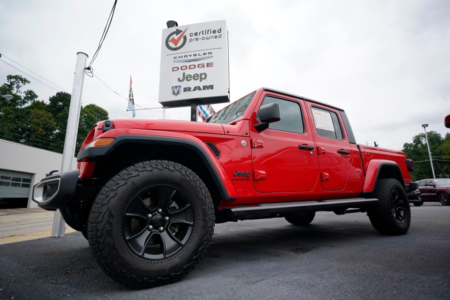 A used 2020 Jeep is on display on a lot in Pittsburgh, Thursday, Sept. 29, 2022. Price increases moderated in the United States last month, Thursday, Nov. 10, in the latest sign that the inflation pressures that have gripped the nation might be easing as the economy slows and consumers grow more cautious. (AP Photo/Gene J. Puskar, File)