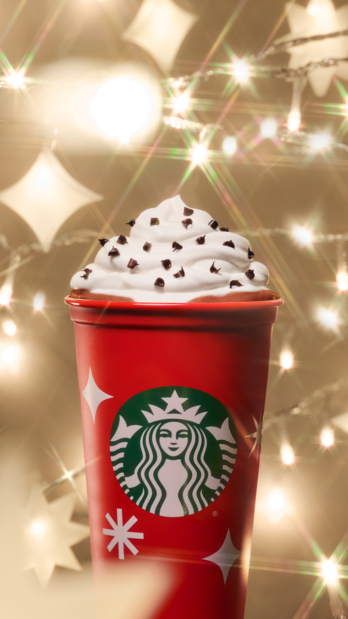 This year’s reusable red cups feature white starbursts and snowflakes for Nov. 17, 2022 in a photo provided by Starbucks.